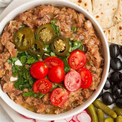  Ful Medames: An Egyptian Breakfast Symphony of Creamy Beans and Tangy Spices!